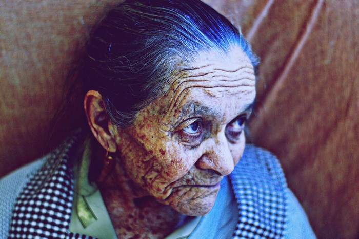 Portrait of an elderly woman with deep wrinkles