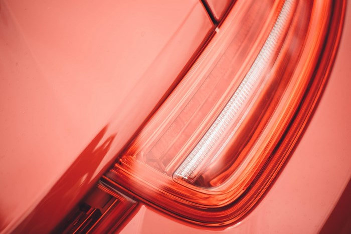 Close-up of a red car's brake light assembly