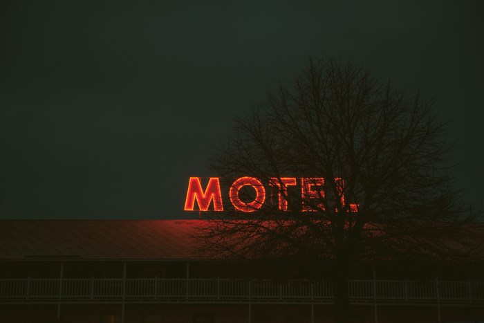 Motel neon sign at dusk