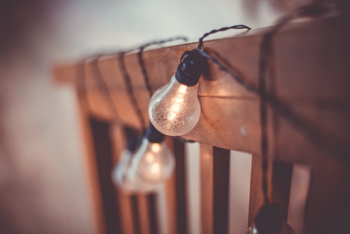 String of vintage light bulbs on a wooden surface