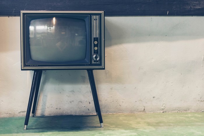 Vintage Sharp television on a stand
