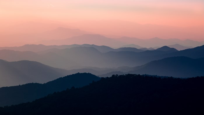 Mountain range at sunset with pink sky