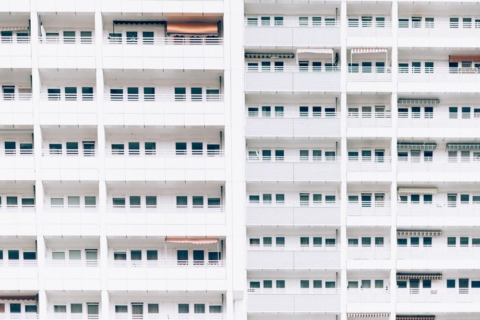 White apartment building with balconies and windows in Berlin