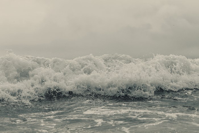 Ocean wave crashing with foam and spray