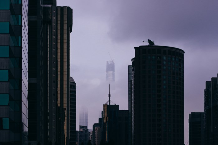 Cityscape with skyscrapers shrouded in fog