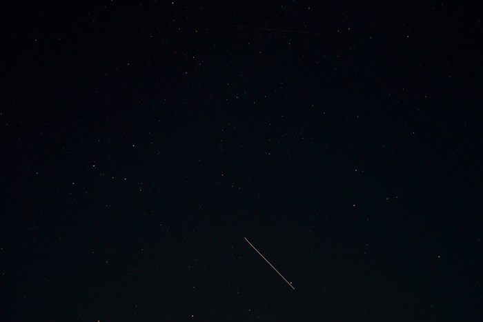ISS passing through a starry night sky