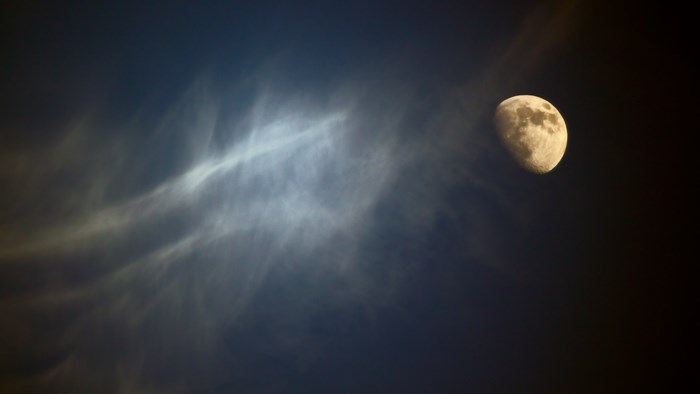Moon and clouds in the night sky