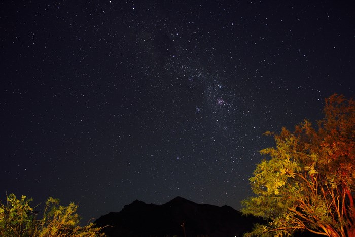 Starry Night Sky Over Namibia Desert Mountain Silhouette