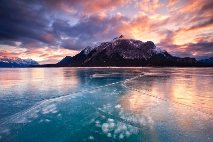 Frozen lake and mountain at sunrise in Canada