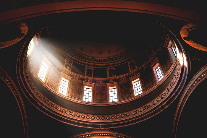 Interior of a dome with sunlight streaming through windows