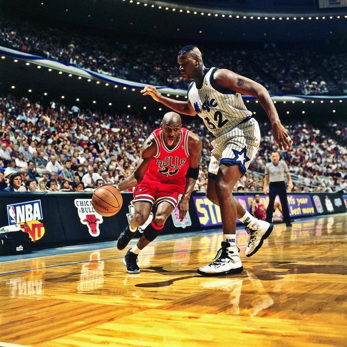 Michael Jordan and Shaquille O'Neal playing basketball