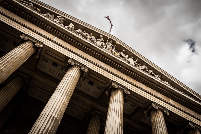Ionic Columns and Statues on a Cloudy Day