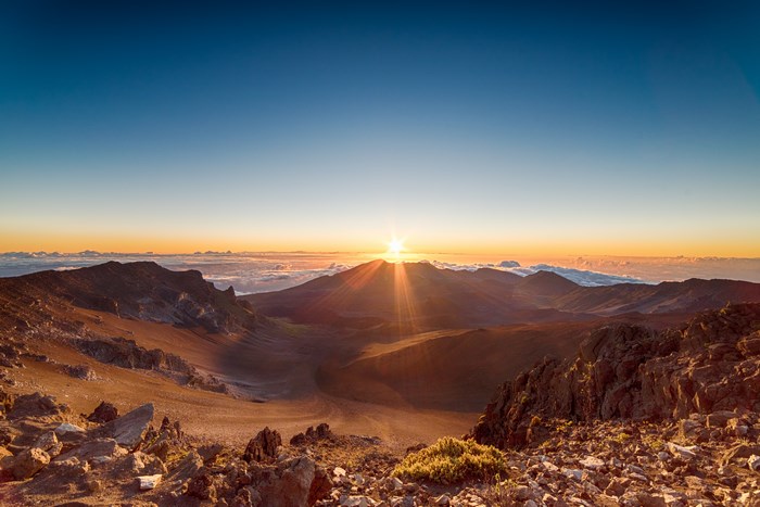 Sunrise over a mountain valley with clouds