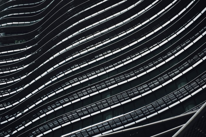 Abstract architectural facade with curved lines and windows