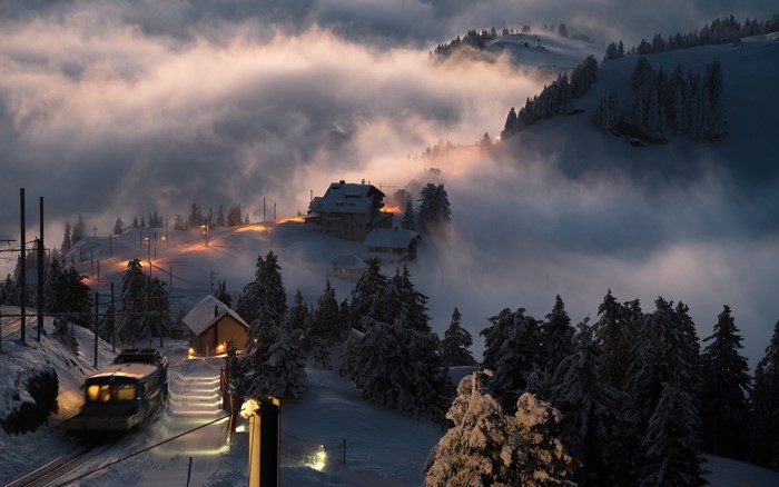 Misty Snowy Swiss Village Train at Sunset