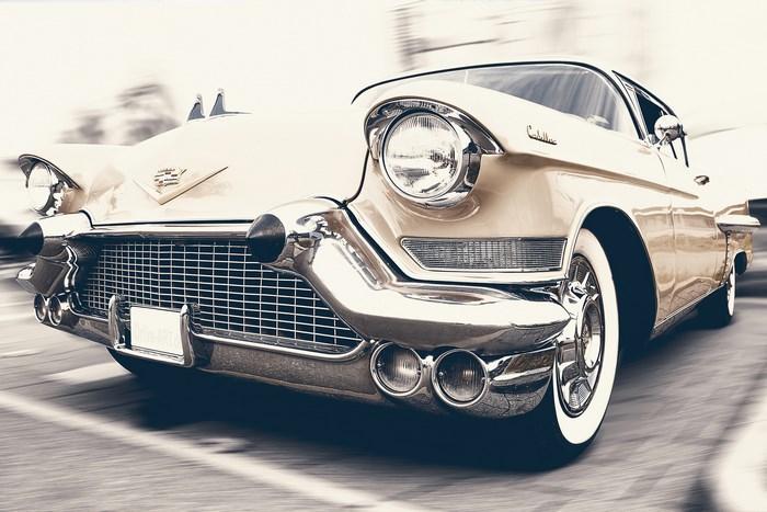 Vintage Cadillac car in motion on a road