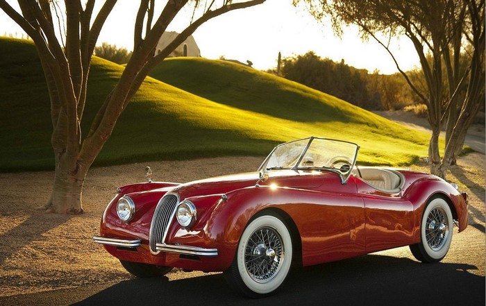 Red Jaguar XK120 Convertible on a Golf Course