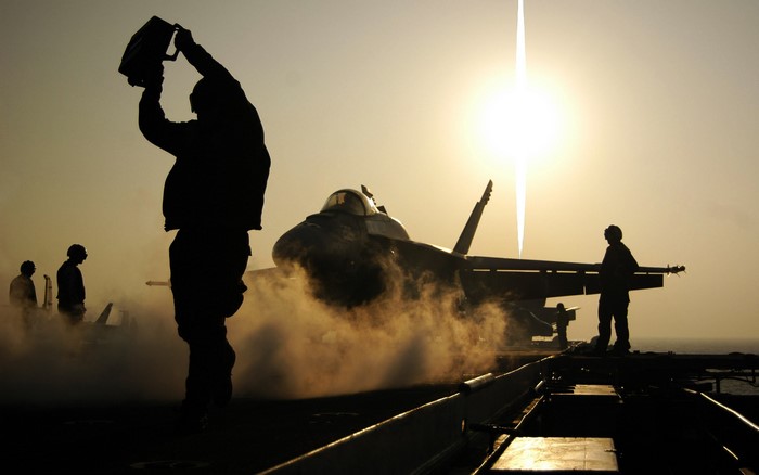 F/A-18 Hornet on Aircraft Carrier at Sunset