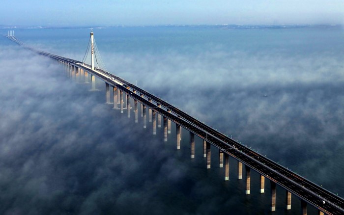 Jiaozhou Bay Bridge shrouded in mist over the sea