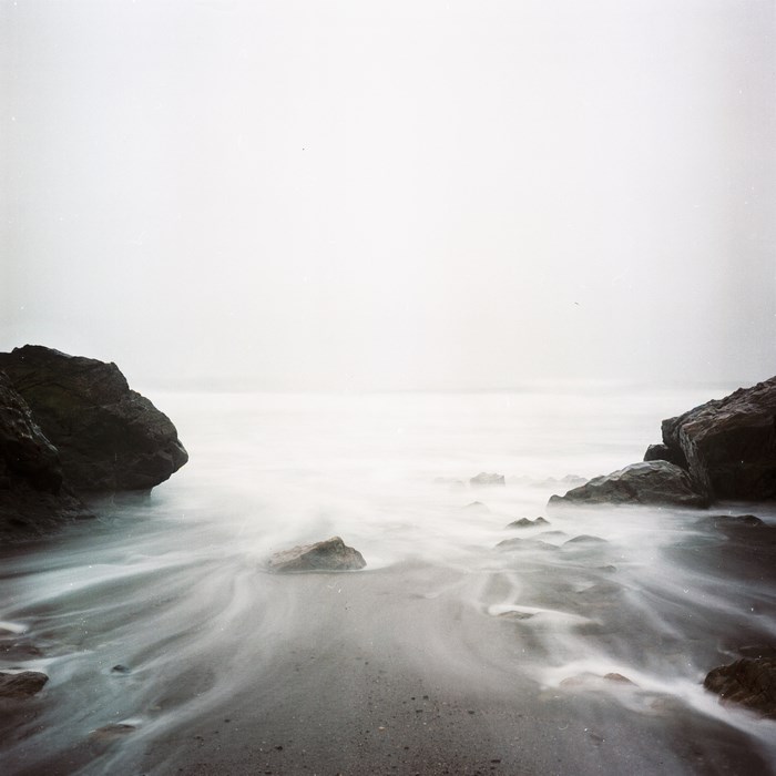 Long exposure of waves crashing on a rocky shore in Portugal