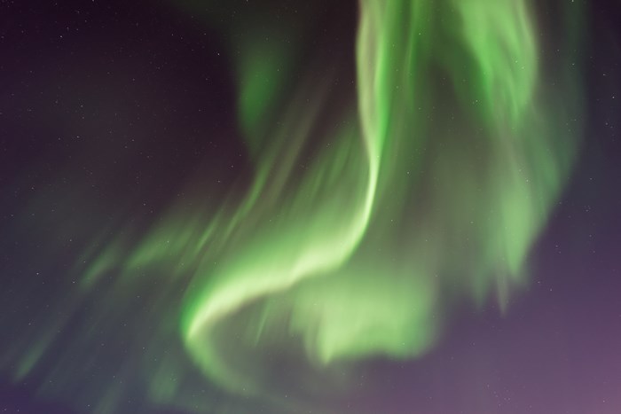 Green Aurora Borealis in a Purple Night Sky
