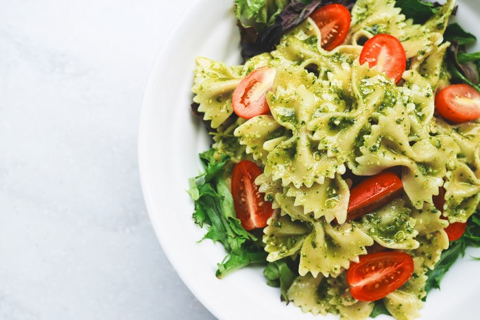 Farfalle pasta with pesto and cherry tomatoes