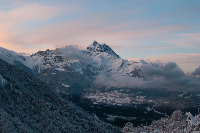 Snow-covered mountains in Switzerland at sunset
