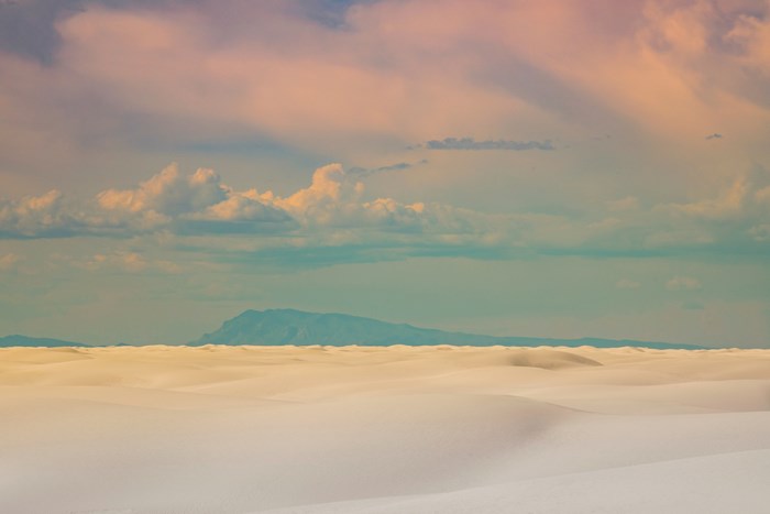 White Sands Desert with Mountains and Clouds
