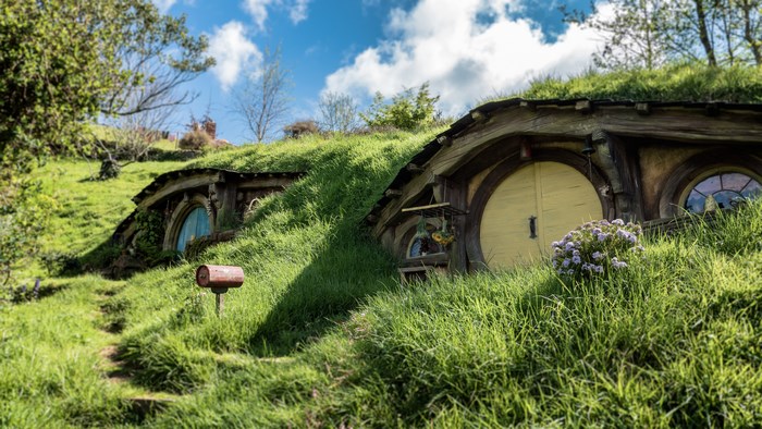 Hobbiton Movie Set Surrounded by Greenery in New Zealand