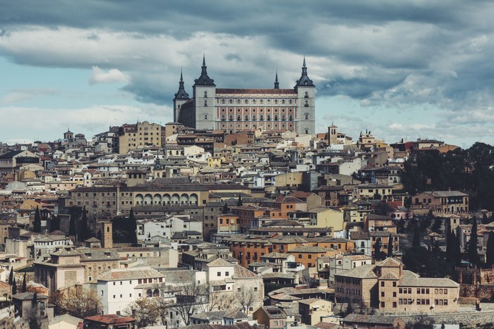 Toledo cityscape with Alcázar of Toledo on a hill