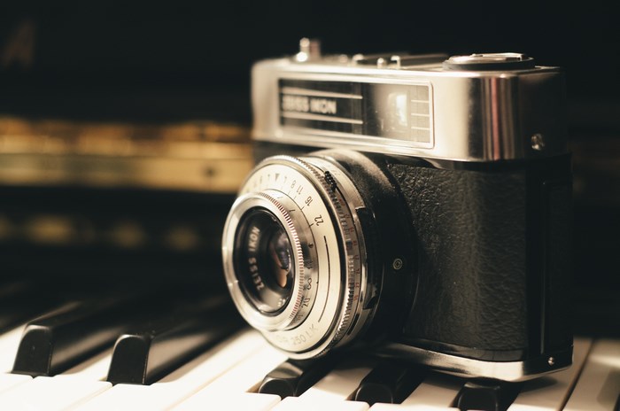 Zeiss Ikon vintage camera on piano keys