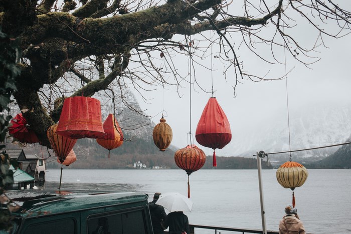 Hallstatt, Austria: Lanterns over a lake in winter