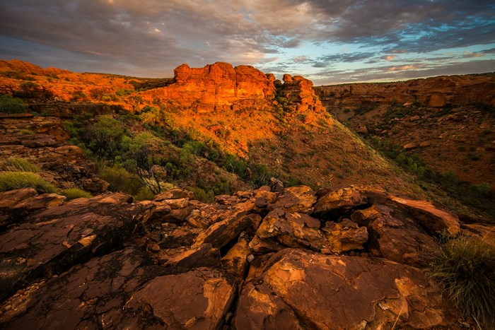 Sunset over a rocky canyon with sandstone cliffs