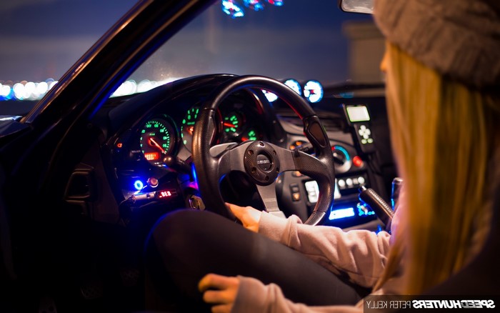 Girl in a Mazda RX-7 with custom interior