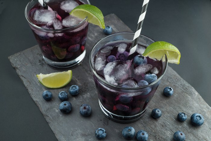 Blueberry lime cocktails with ice and blueberries