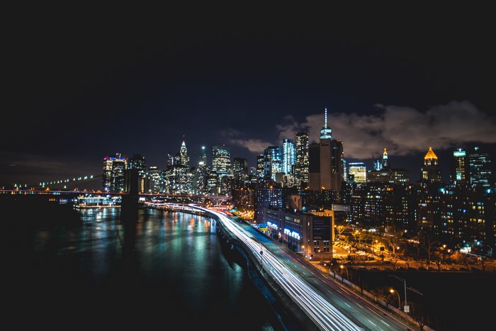 New York City skyline at night with Brooklyn Bridge