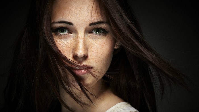 Woman with freckles and green eyes