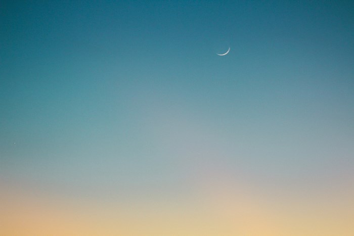 Crescent Moon in a Gradient Sky at Sunset