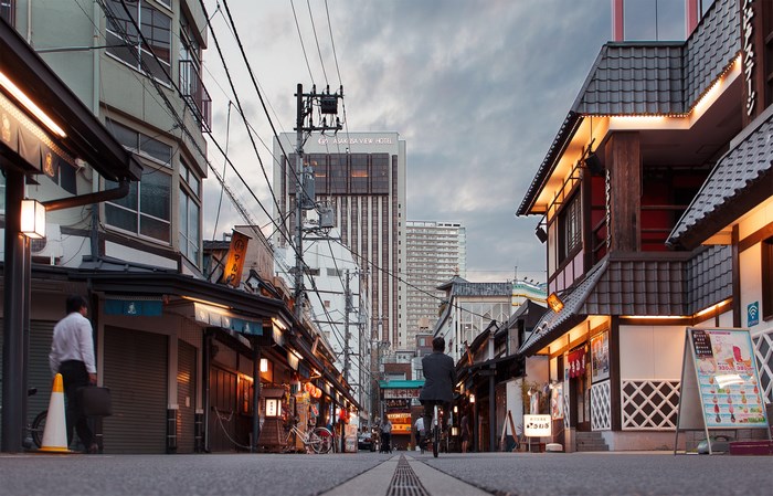 Street scene in Asakusa, Tokyo with traditional and modern buildings