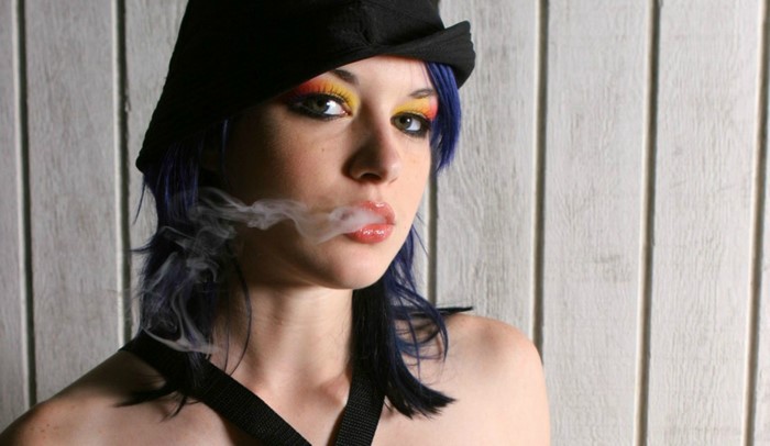 Woman in hat smoking