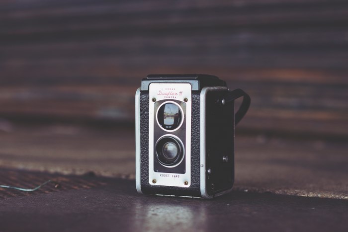Kodak Duaflex II vintage camera on a wooden surface