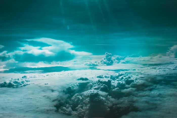 Sun rays shining through clouds from above
