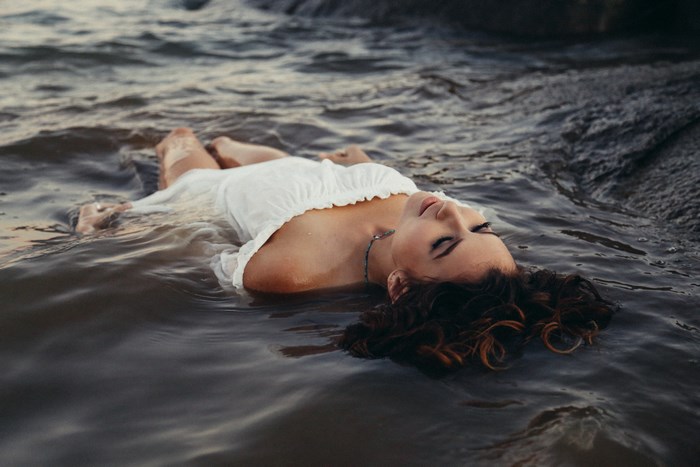 Woman floating in water at Folsom Lake