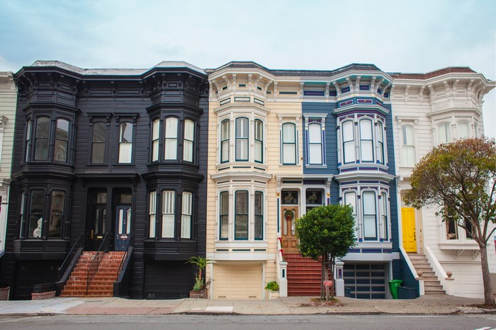 Row of colorful Victorian houses on a city street