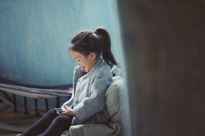 Girl using an iPhone