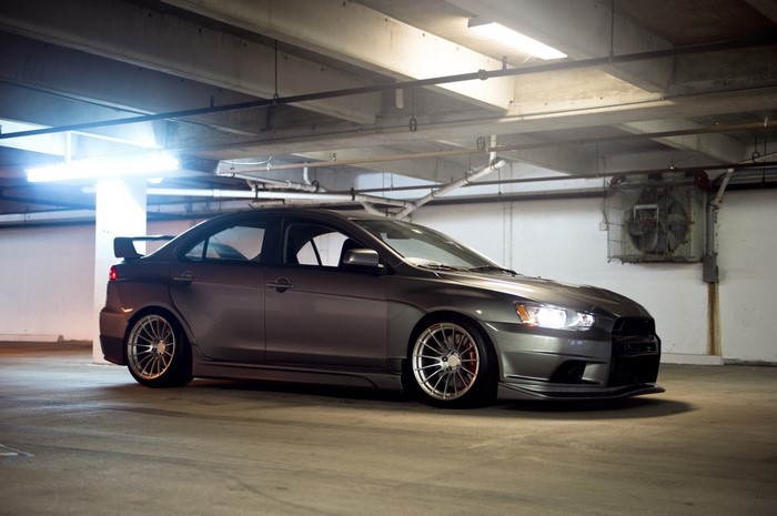 Mitsubishi Lancer Evo X in a parking garage