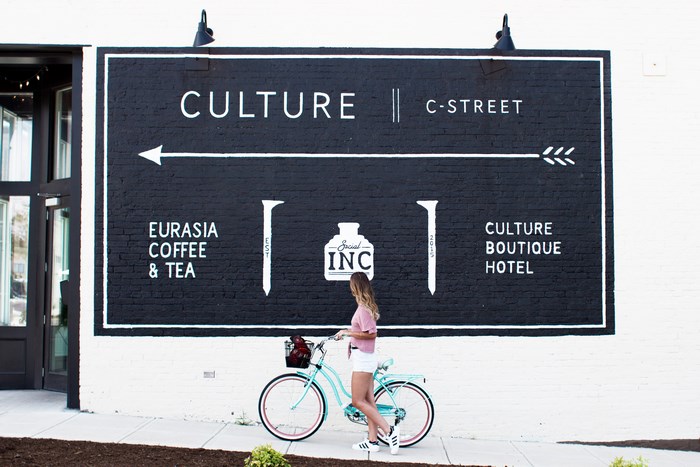 Culture C-Street mural with woman and bicycle