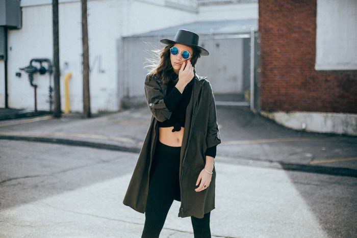 Woman in hat and sunglasses on a street