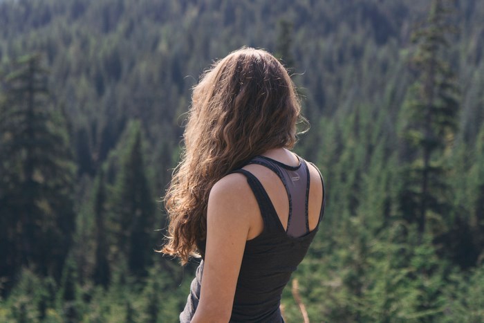 Woman with long hair in a forest