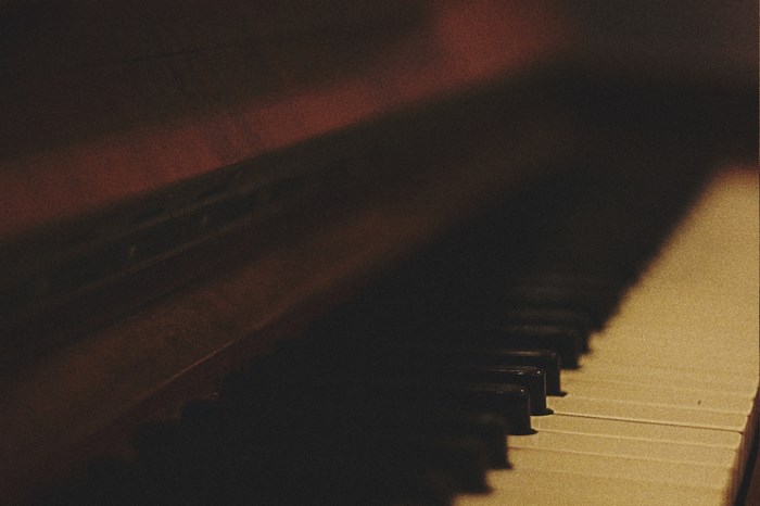 Close up of piano keys with dramatic lighting